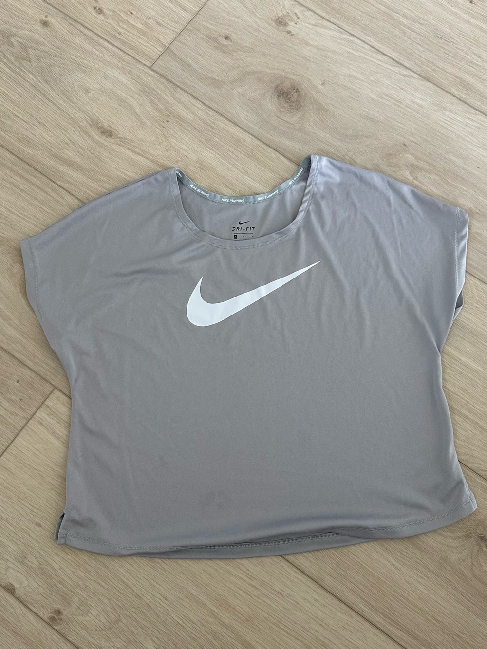 Nike Women's Light Gray Short Sleeve Dri-FIT Tee with White Swoosh